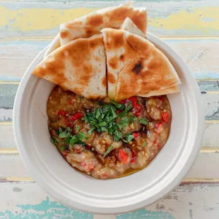 Baba Ganoush with Warm Pita - Roasted eggplant, roasted red pepper, parsley served with warm pita