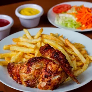 a plate of chicken and french fries