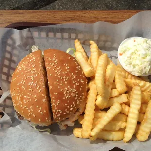 a hamburger and french fries on a tray