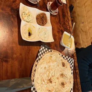 Hot tea and complementary appetizers that come with the plate