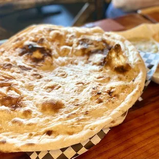 a tortilla and a side of coleslaw