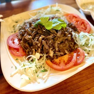 a plate of meat and vegetables