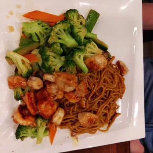 Chicken and shrimp with vegetables and fried rice and noodles