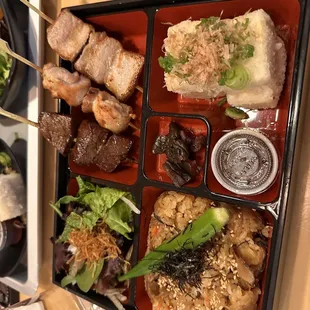 Port and steak skewers and agedashi tofu, seasoned rice.