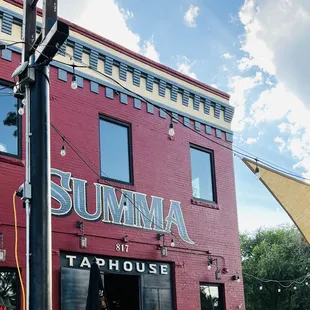 a red brick building with a yellow awning