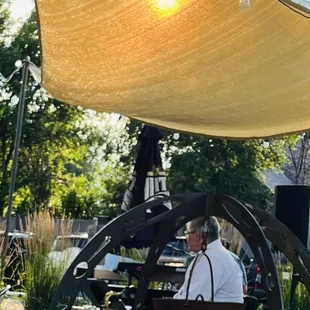 a man sitting at a table with a cocktail in front of him
