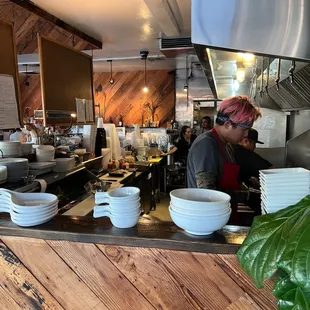 a man preparing food in a restaurant kitchen
