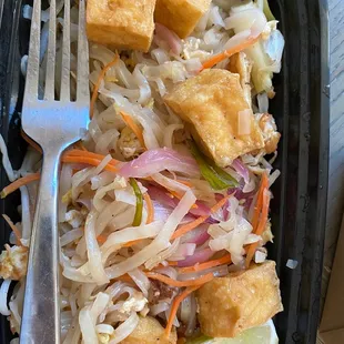 tofu, cabbage, carrots, and a fork