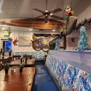 the dining area of a tropical themed restaurant