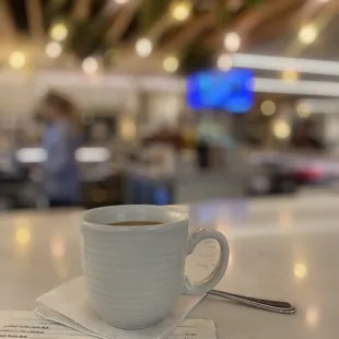 a cup of coffee on a table