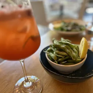 Steamed edamame with Strawberry Fields mocktail