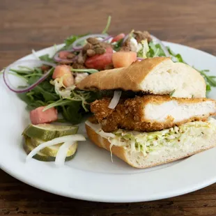 Free Range Crispy Chicken Half Sando with Arugula Salad.