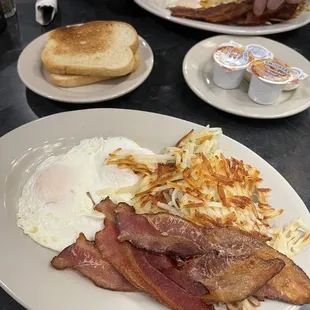 bacon, eggs, hash browns and toast