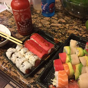 Spicy tuna roll, spicy tuna roll with tuna on top (customized for me) and 2 rainbow rolls.