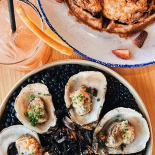 a plate of oysters and a plate of waffles
