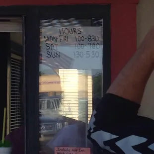 a man taking a selfie in front of a window