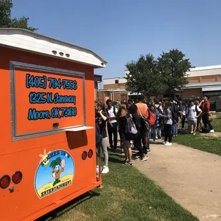 a line of people waiting in line