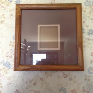 Empty frame in room, funny.