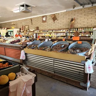 Fresh organic produce, nuts, and snacks.