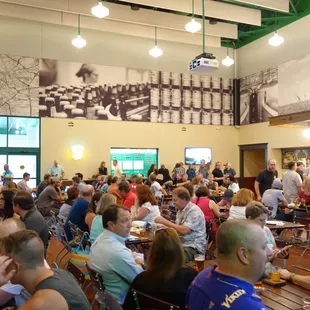 a large group of people sitting at tables
