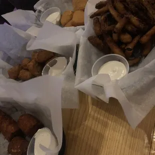 Pickle fries, loaded tater tots, Mac n cheese bites, and broccoli and cheese bites.