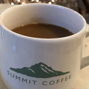 Black coffee with a splash of oat milk.