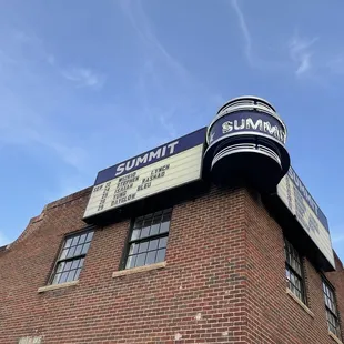  brick building with a sign on top