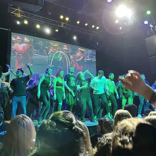  group of people dancing on a stage