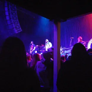  band playing on stage at night