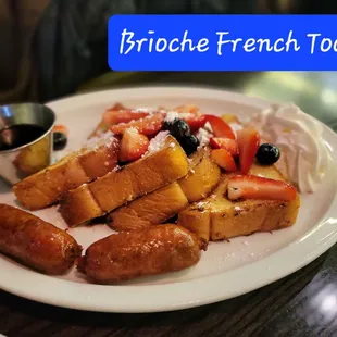 a plate of french toast and fruit