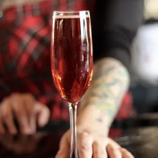 a woman holding a wine glass