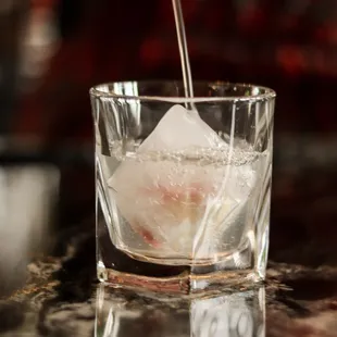 a drink being poured into a glass