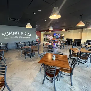 a dining area with tables and chairs