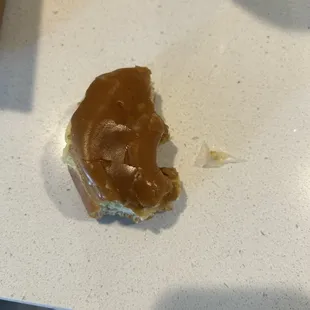 Maple donut and plastic that was inside