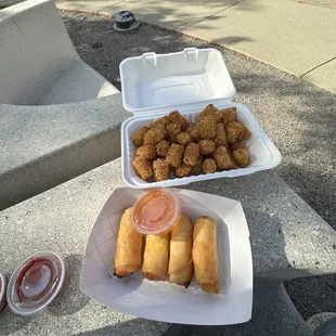 two take out containers of food