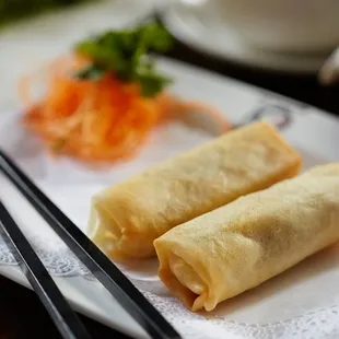 a pair of chopsticks on a plate