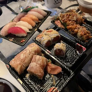 Sushi delux (10pieces sushi and spicy tuna roll) Mr salmon roll Volcano roll