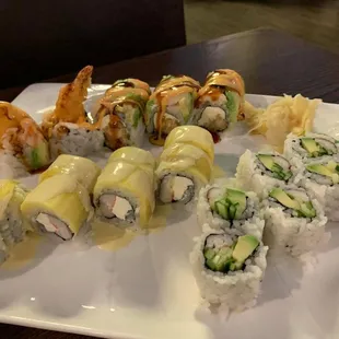 Yummy yummy roll (yellow one), ichiban roll (roll in back of pic), California roll (right side)