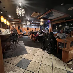 a restaurant with people sitting at tables