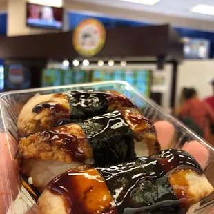 Establishment in the background. Unagi nigiri $5.02 with tax