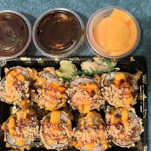 Volcano roll with teriyaki sauce, eel sauce and spicy mayo