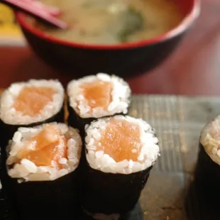 a plate of sushi and a bowl of soup