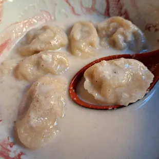 Close-up of Banshtai Tsai, Mongolian beef dumplings (bansh) served in milk tea. Order 1 day in advance.