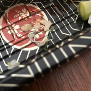 a plate of sushi and vegetables