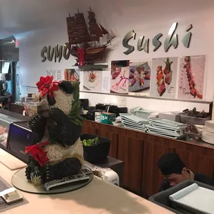 Behind the sushi bar