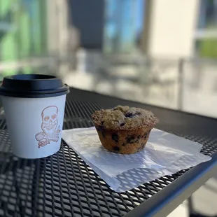 a muffin and a cup of coffee