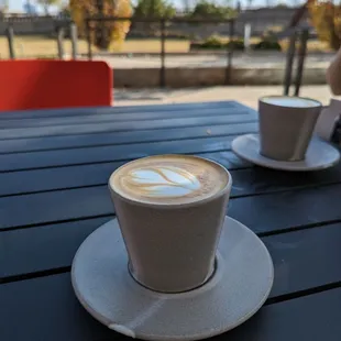 two cups of coffee on a table