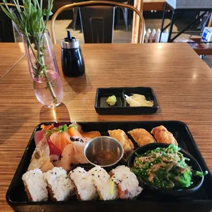 SASHIMI LUNCH BOX - 7 pieces - $20 Served with cucumber and seaweed salad, gyoza, miso soup, Tuna Cut Roll