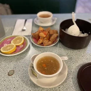 ows a table with a bowl of soup, a bowl of soup, a bowl of