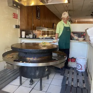 Open for take-out. You can still watch your food being cooked